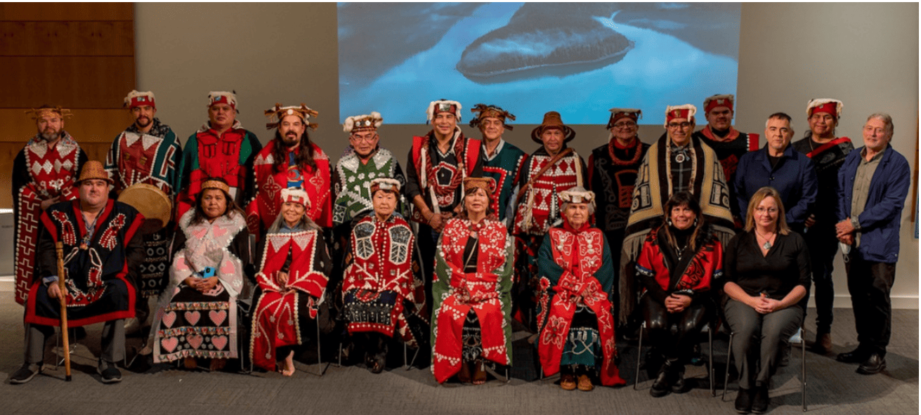 An image of the Gwaxdlala First Nation seated in regalia.