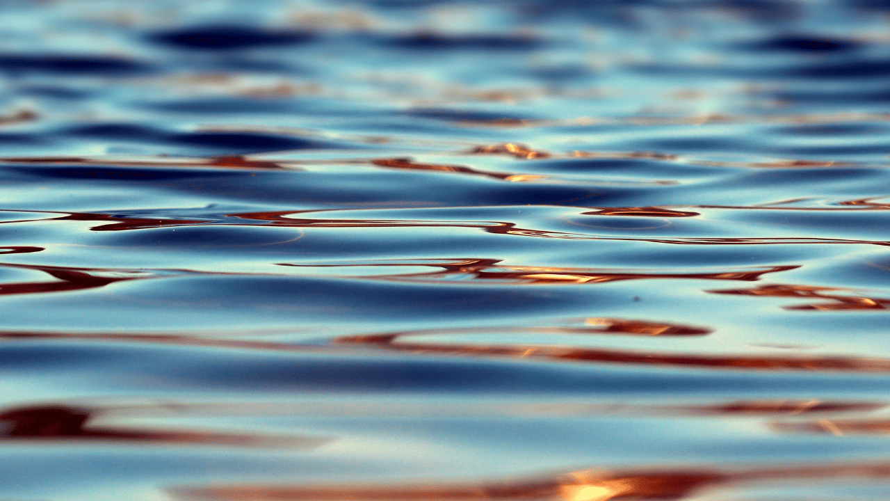 A close-up image of water with small ripples.