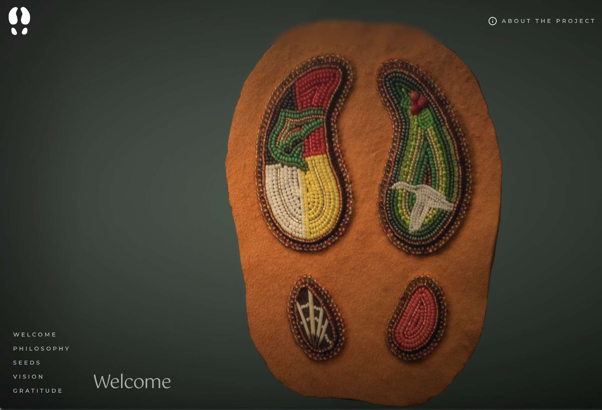 Emblem on Reconciliation.vision Website: A Leather Patch Adorned with Caribou Footprint Beading