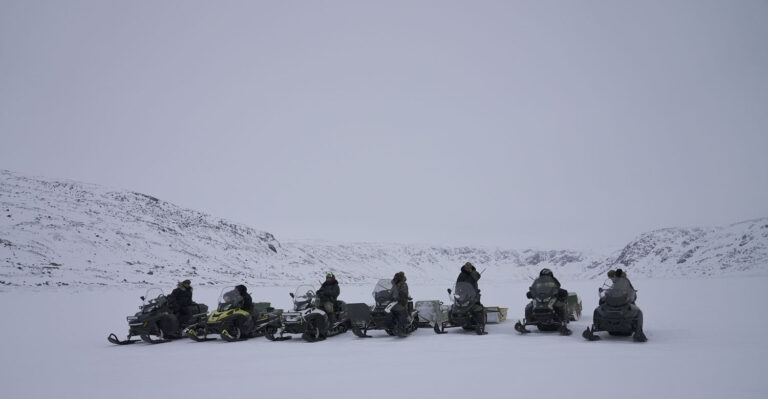 Participants going on a polar bear filming excursion for the Nanuk Narratives project outside of Kangiqsualujjuaq, Nunavik, in the winter of 2023.